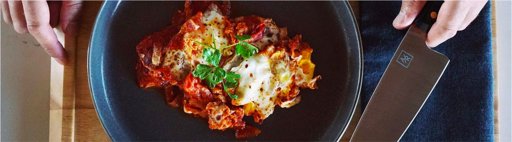 Shakshuka. Tomatoes, onions, garlic, spices and gently poached eggs.